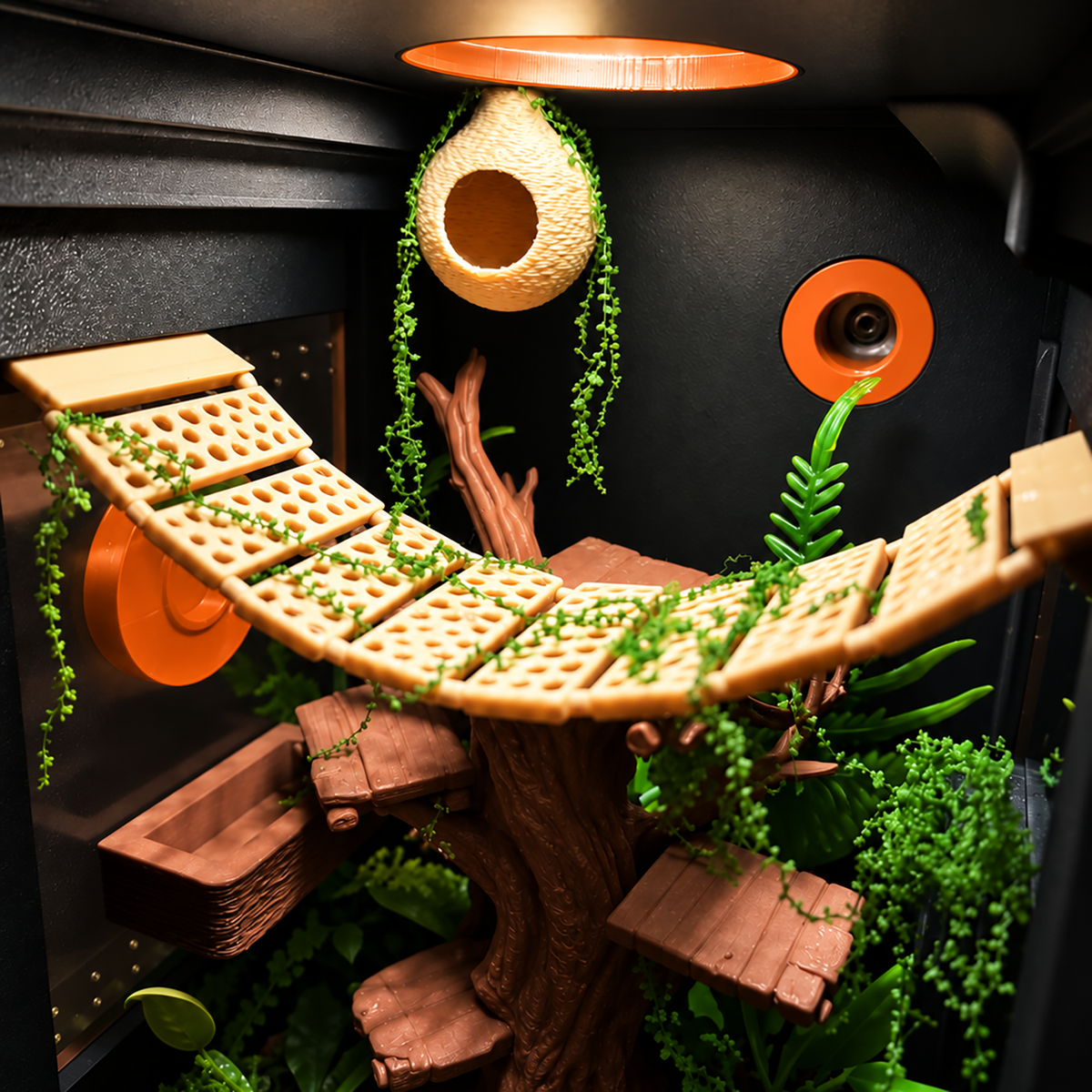 A highly detailed, custom-built treehouse-style habitat or play structure made from natural wood, featuring a curved elevated plank bridge with green trailing vines, multiple wooden platforms, a hanging woven nest, and a faux tree trunk.