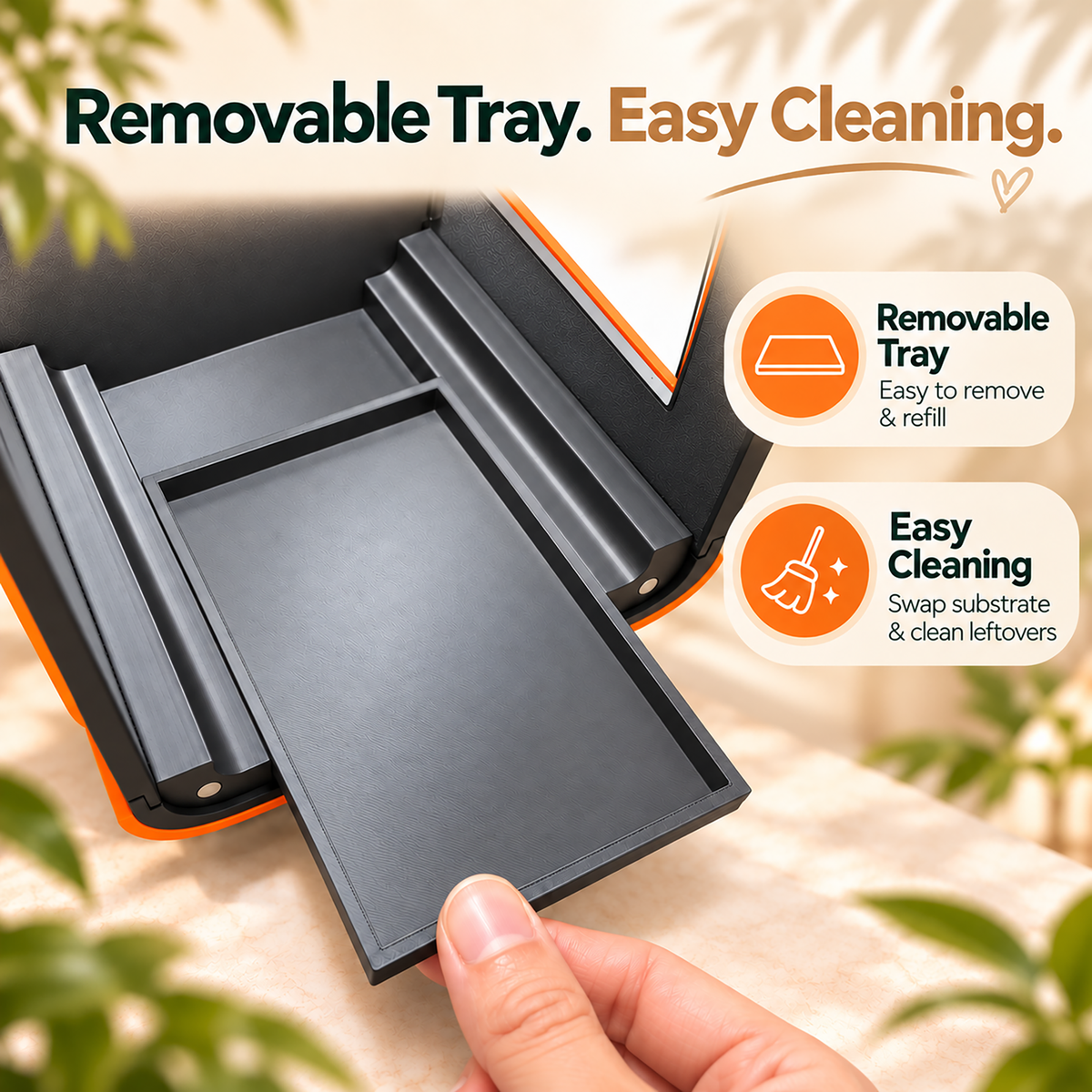 A close-up of a black removable tray being pulled out by a hand, with promotional text reading 'Removable Tray. Easy Cleaning.