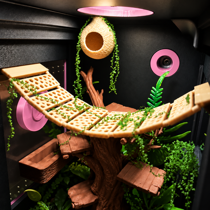 A highly detailed, custom-built treehouse-style pet playpen or terrarium setup featuring a curved wooden bridge made of biscuit-like panels, a hollow tree trunk den, hanging green vines, and lush faux foliage against a black background with pink circular accents.